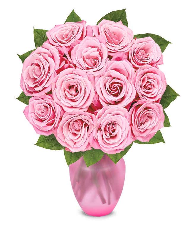 A delicate arrangement featuring one dozen light pink roses. This elegant and timeless display offers a touch of romance and sophistication, perfect for any special occasion.