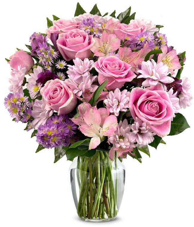 A bouquet featuring pink roses, purple daisies, pink alstroemeria, purple alstroemeria, and purple Monte Casino, with an optional vase.