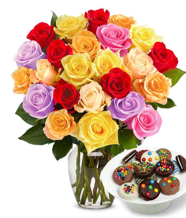 Two Dozen Rainbow Roses bouquet with a dozen Sprinkled Chocolate Covered Oreos, optional glass vase, and personalized gift message.