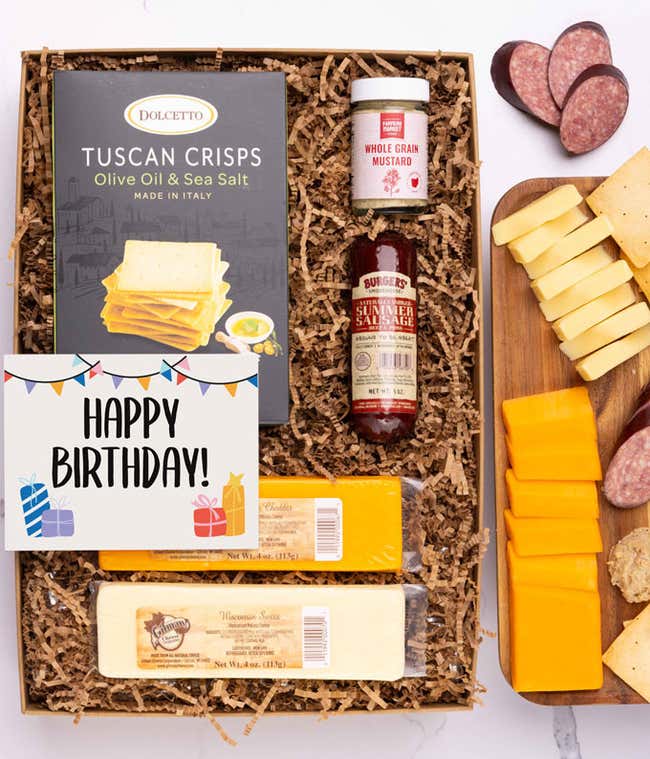 A charcuterie box with two types of cheese, crackers, stone-ground mustard, a summer sausage and a cheerful Happy Birthday message card.