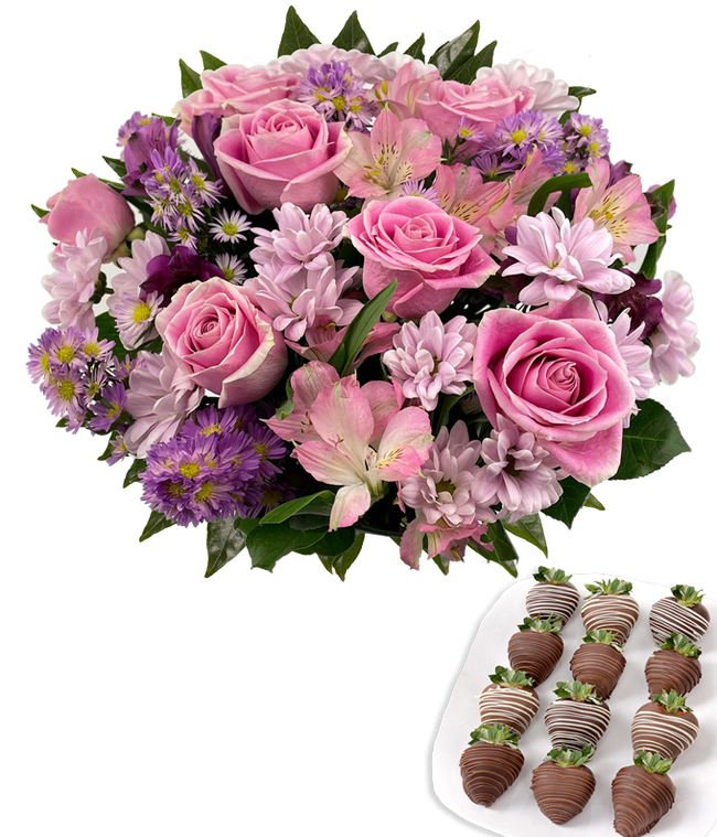 Partial image of  Deluxe bouquet of pink roses, lavender cushion poms, pink and purple alstroemeria, and purple asters in a clear glass vase, paired with swizzled chocolate-covered strawberries. without vase.